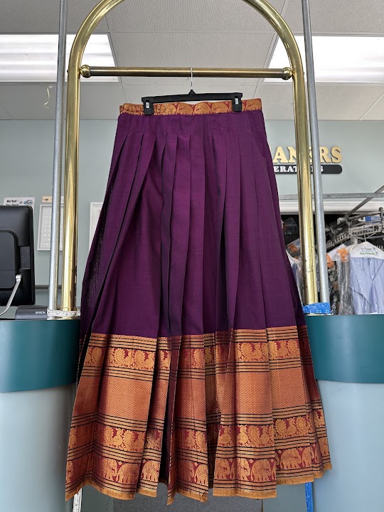 Om's Cleaners storefront photo from Google
