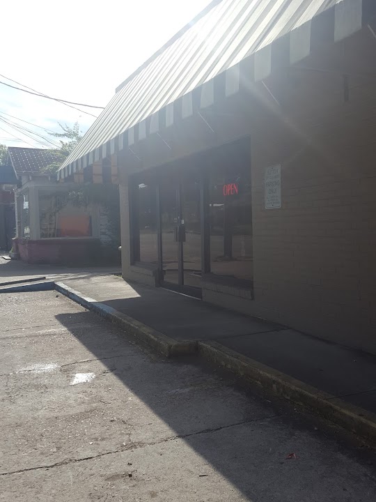 Sutton's Dry Cleaners storefront photo from Google