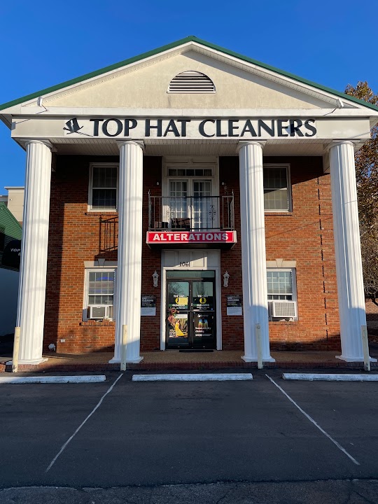 Top hat cleaners storefront photo from Google